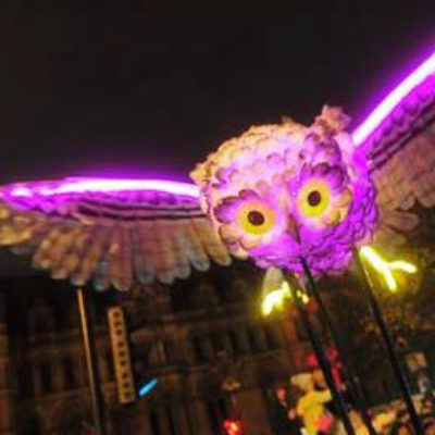 A huge purple and gold illuminated owl; part of the Manchester Diwali celebrations.