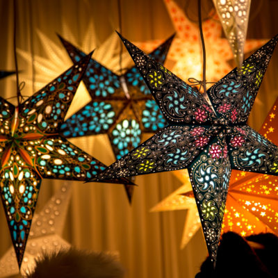 Paper star shaped lamps lit up