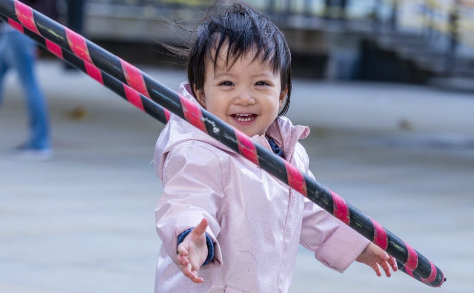 A child plays with a hula hoop