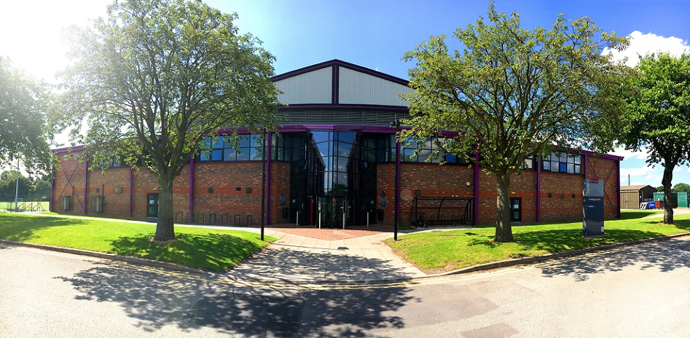 Outside of sports centre on a sunny day
