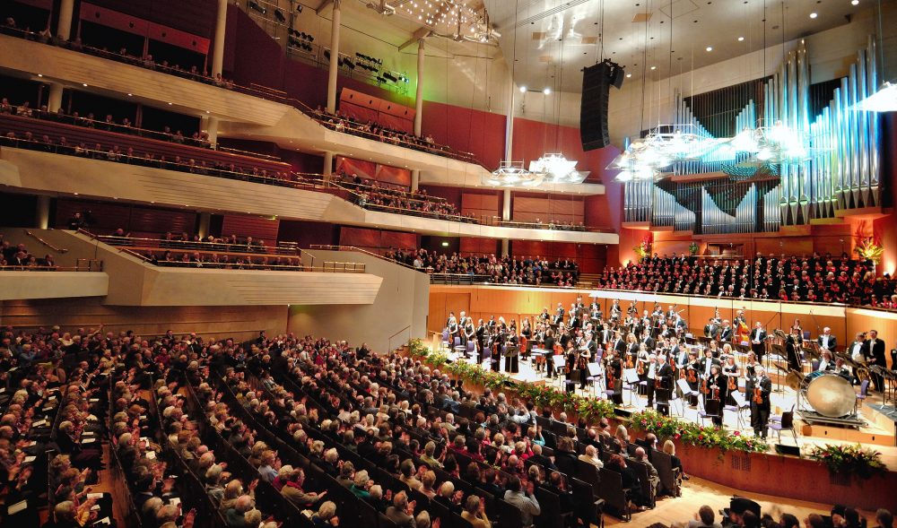 An orchestra on stage in a theatre