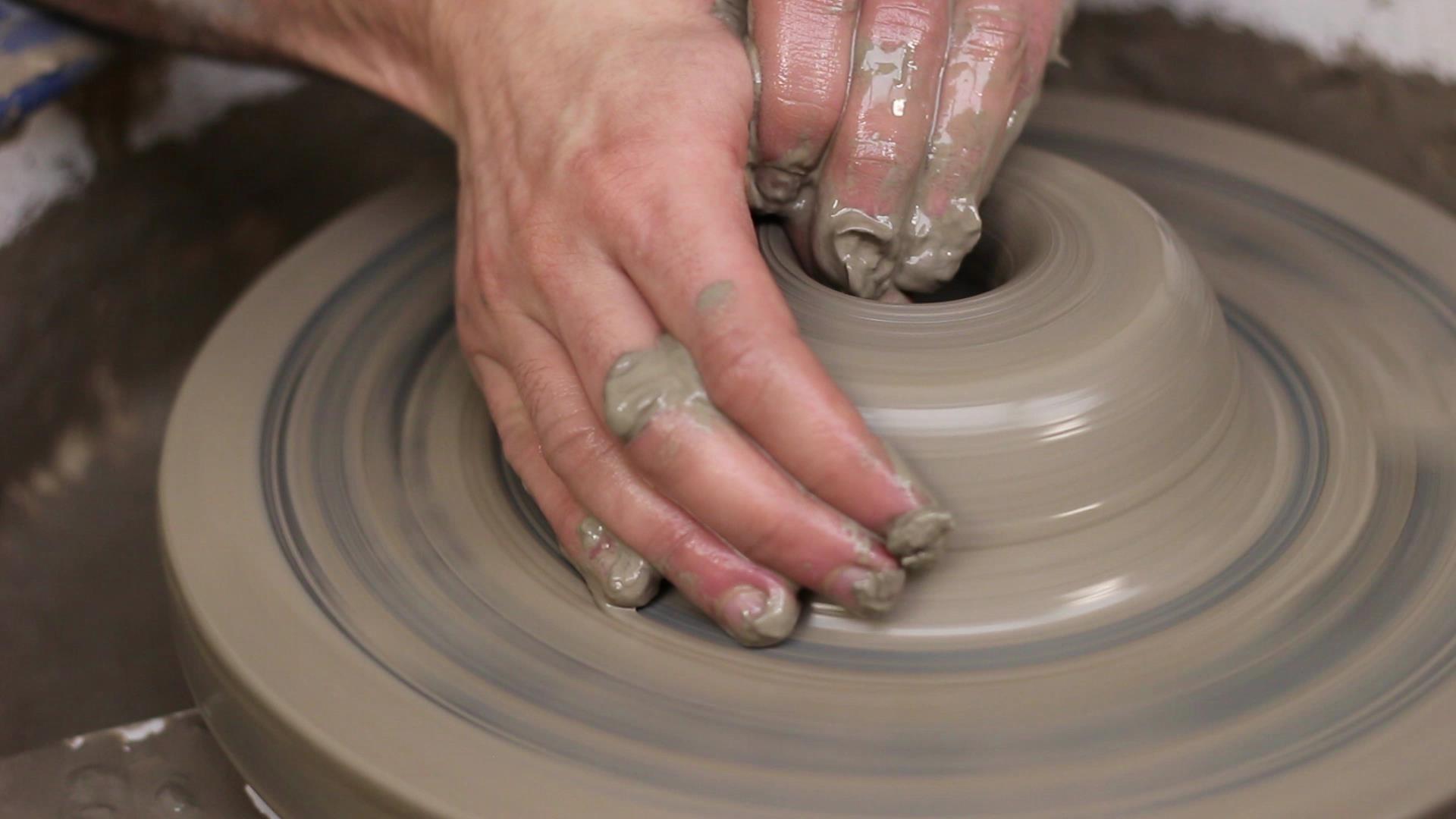 A potters wheel with clay