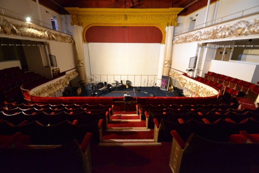 Empty theatre, with gear on stage