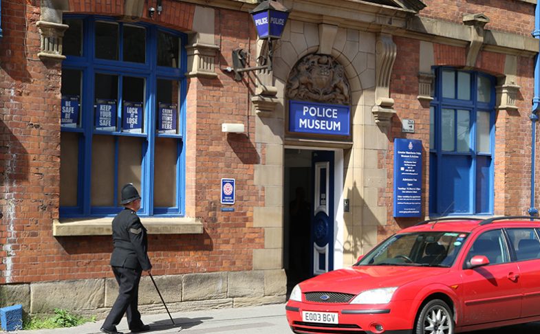 A man stands outside The Police Museum