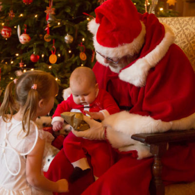 Two children with Santa Claus