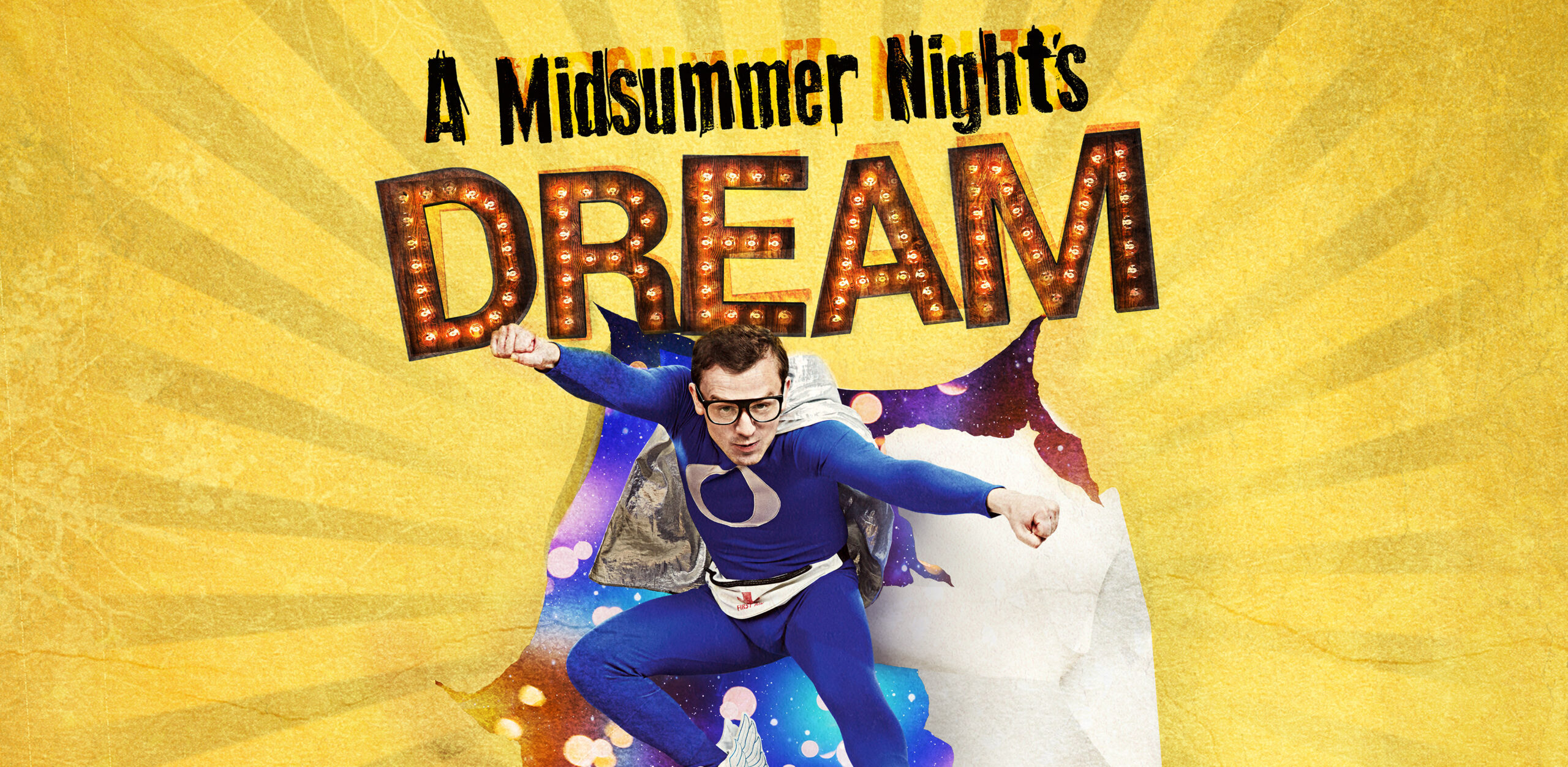 A super hero jumps through a banner with the words 'A Midsummer Night's Dream' on it.