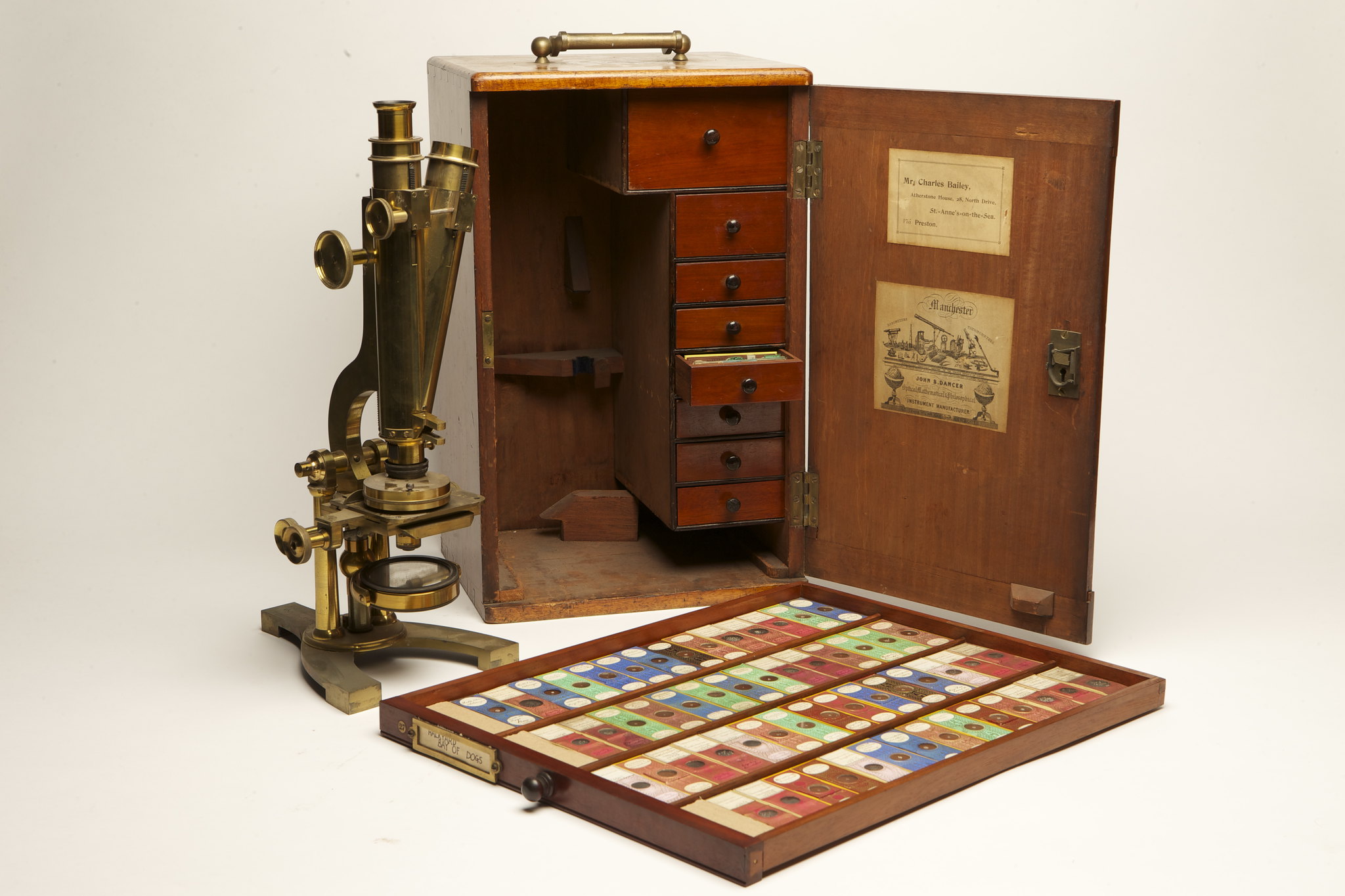 An old fashioned boxed microscope and a collection of nature slides.