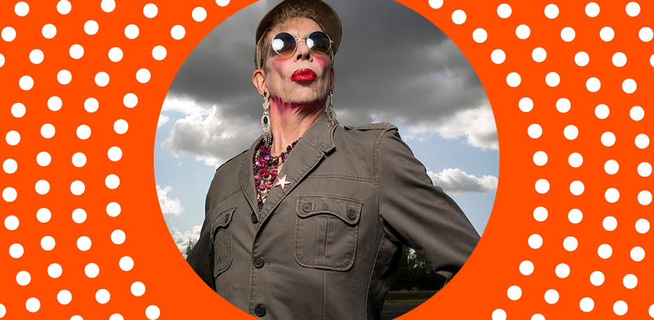 David Hoyle stands looking out to the backdrop of a gloomy grey sky.