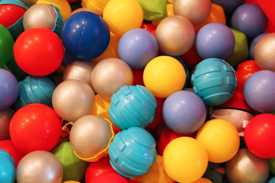 A pile of brightly coloured balls at a children's play centre.