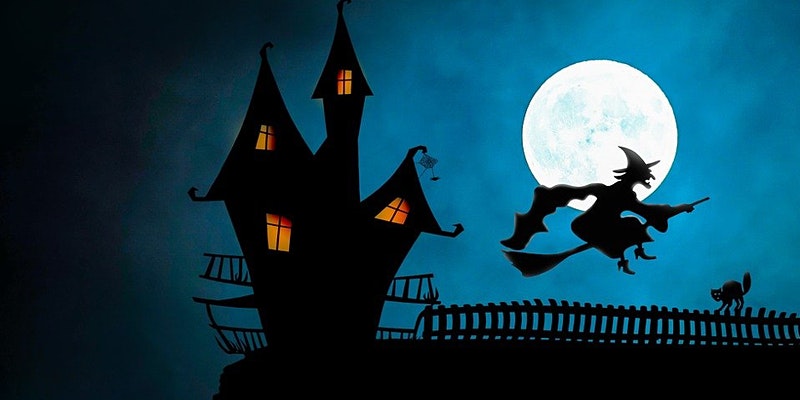A spooky looking house on the night of a full moon as a witch flies past on a broomstick.