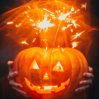 A Halloween pumpkin lit up with soarklers.