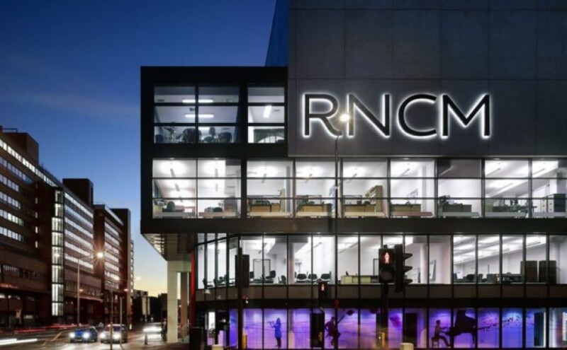 The exterior of the RNCM building at night