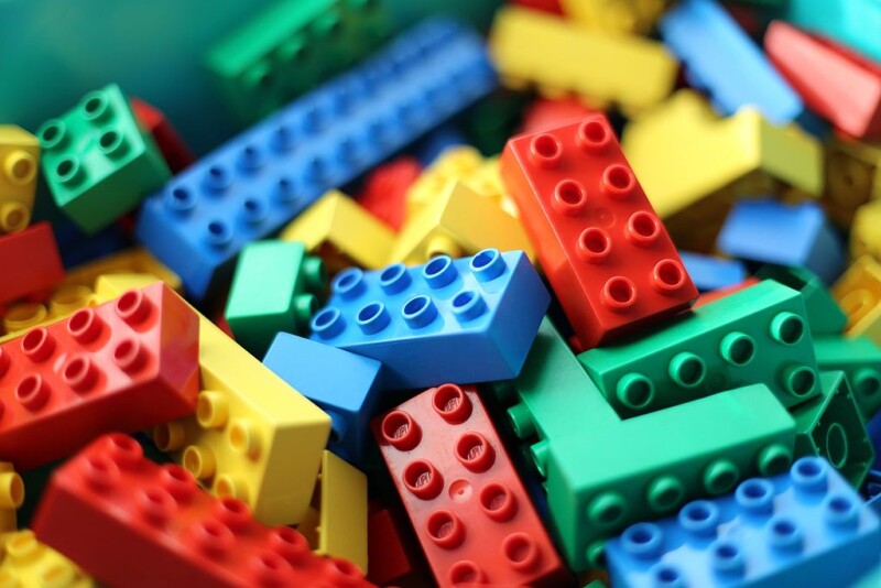 A pile of red, blue, yellow and green lego bricks.