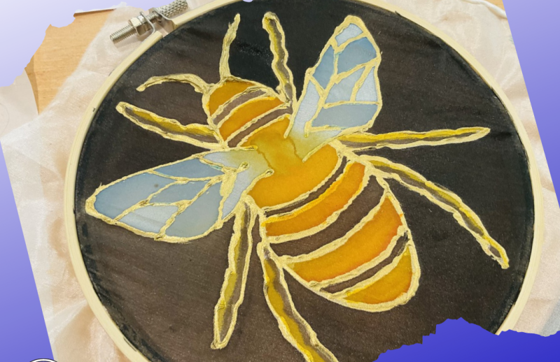 A hand-crafted silk painting of a bee.