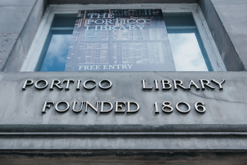 Sign with the words Portico Library Founded 1806