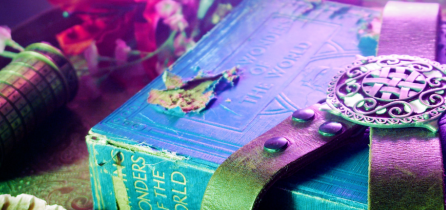 A purple hardback book with 'The Wonders of the World' printed on its spine.