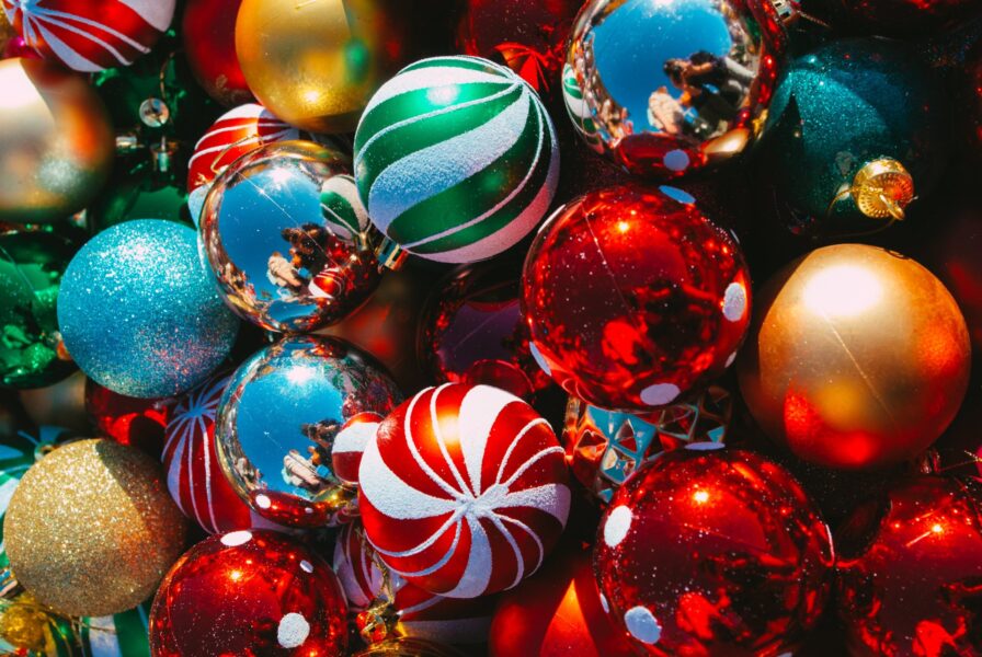 A pile of different coloured Christmas baubles.