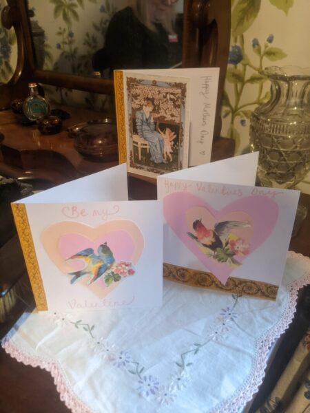 Three children's cards in displayed on a table.