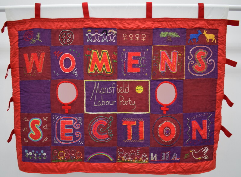 A red and purple patchwork banner. The text reads Mansfield Labour Party Women's Section