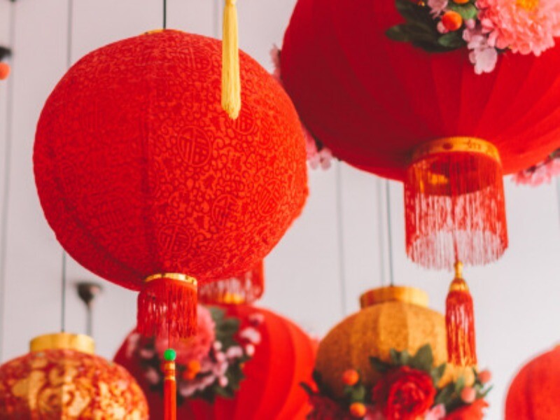 Chinese red lanterns hang down from the ceiling.