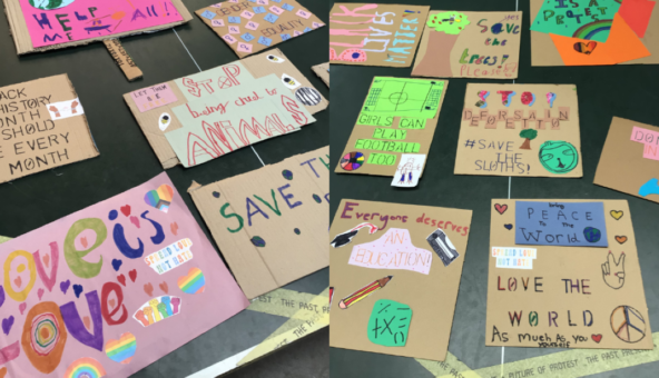 Colourful placards with messages which include Love the World and Girls can play football too.