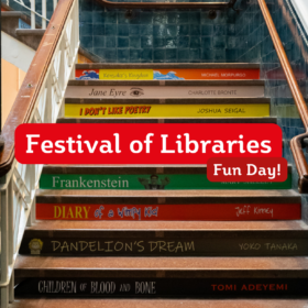A staircase made from books with a red banner that reads 'Festival of Libraries Fun Day'.