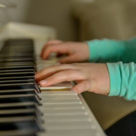 A pair of hands playing the piano.