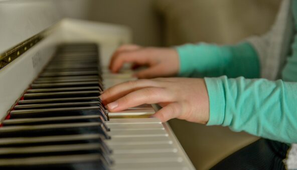 A pair of hands playing the piano.