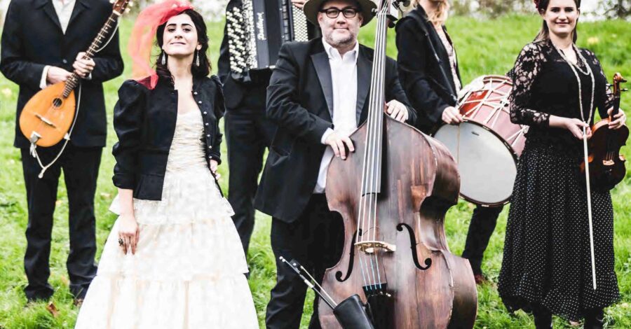 The band She'Koyokh with their instruments in a park