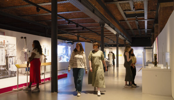 Visitors to the Injecting Hope exhibition at Science and Industry Museum