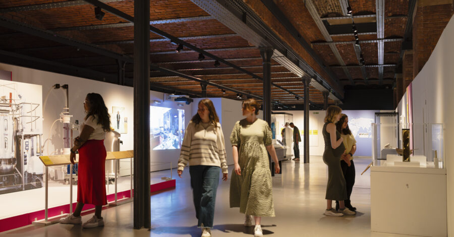 Visitors to the Injecting Hope exhibition at Science and Industry Museum