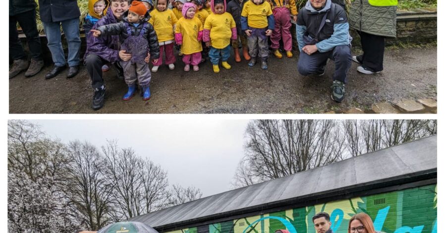 A group of children in coats and wellies stand outside Debdale Park.