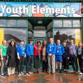 The Youth elements team stand outside their headquarters.