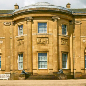 The outside of Heaton Hall on a sunny day.