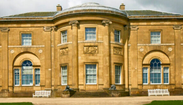 The outside of Heaton Hall on a sunny day.