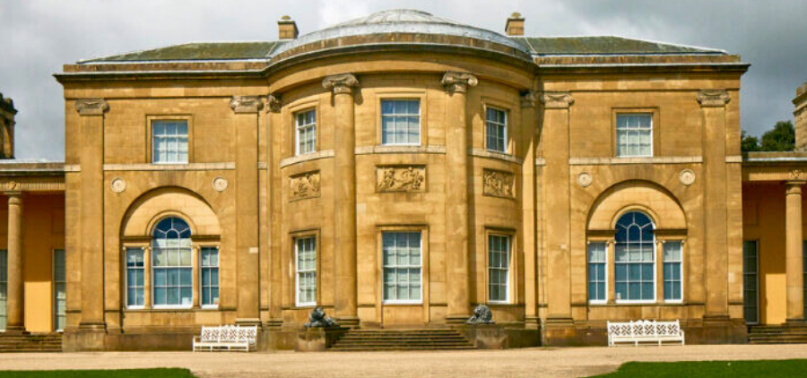 The outside of Heaton Hall on a sunny day.