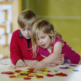 Two children enjoying an activity at the Science and Industry Museum.