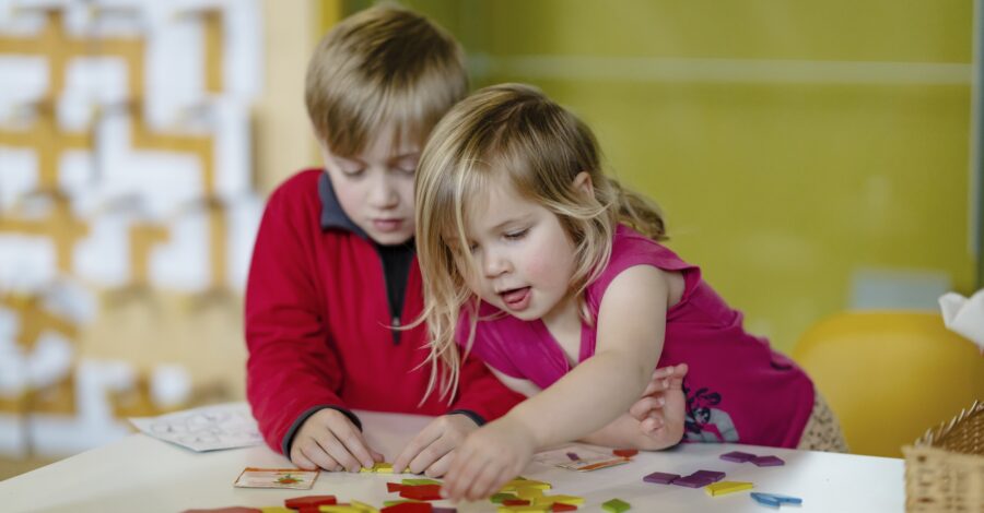 Two children enjoying an activity at the Science and Industry Museum.