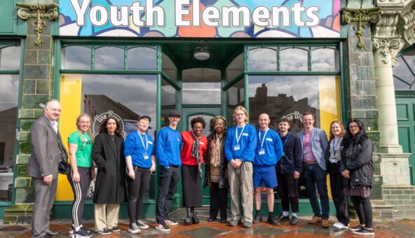 The Youth Elements team stand outside their headquarters.