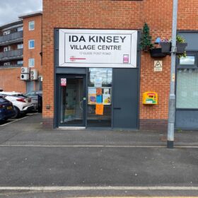 The exterior of the Ida Kinsey Community Hall with a sign saying 'ida Kinsey Village Centre'.