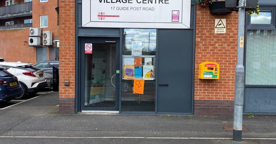 The exterior of the Ida Kinsey Community Hall with a sign saying 'ida Kinsey Village Centre'.