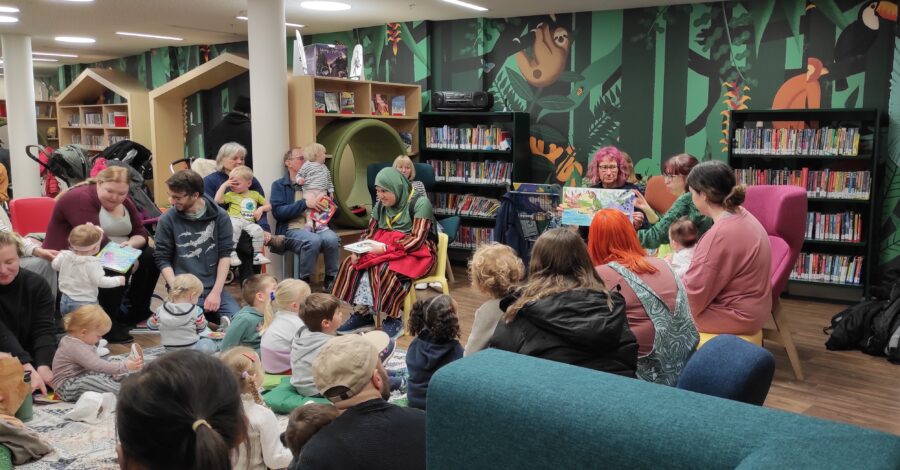 Children and adults attending BSL Storytime event at Manchester Central Library