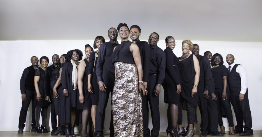 The people of AMC Gospel Choir standing next to oneanother in a v shape.