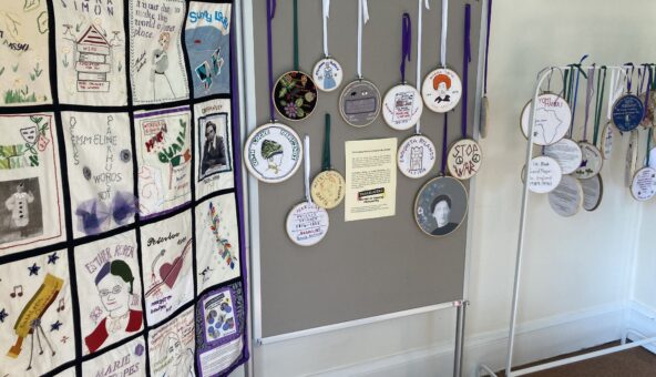 A display of textile art, including a banner, at Elizabeth Gaskell's House.