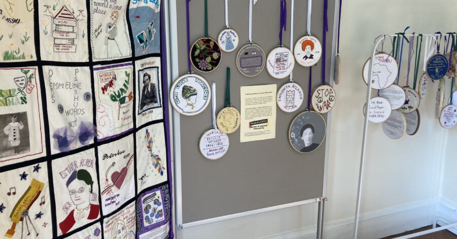 A display of textile art, including a banner, at Elizabeth Gaskell's House.