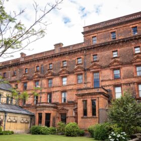 The brick facade of St Bede's Catholic College in Whalley Range.