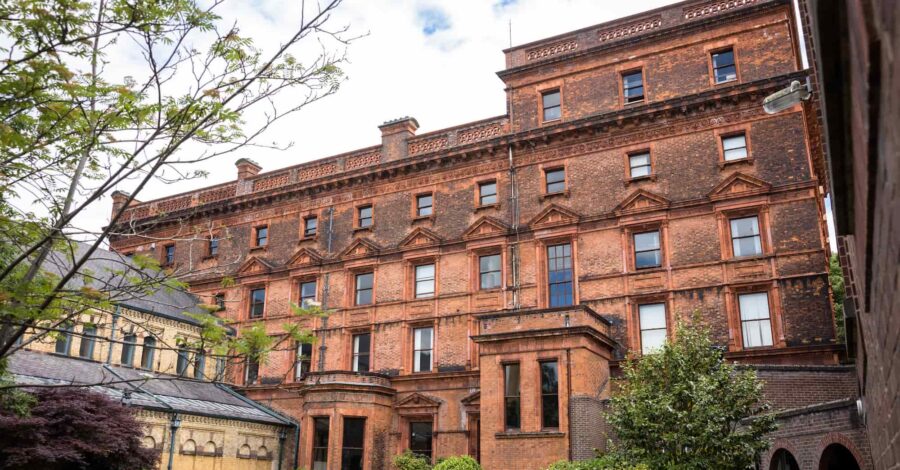 The brick facade of St Bede's Catholic College in Whalley Range.