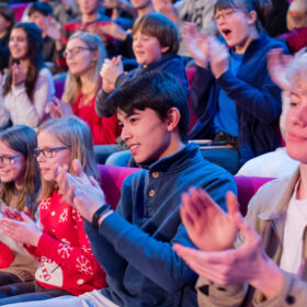 Audience clapping and cheering at the Royal Institution Christmas Lectures