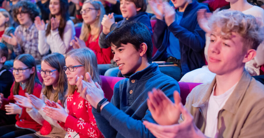 Audience clapping and cheering at the Royal Institution Christmas Lectures