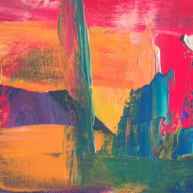 abstract image - mainly yellow/orange with splashes of blue and green